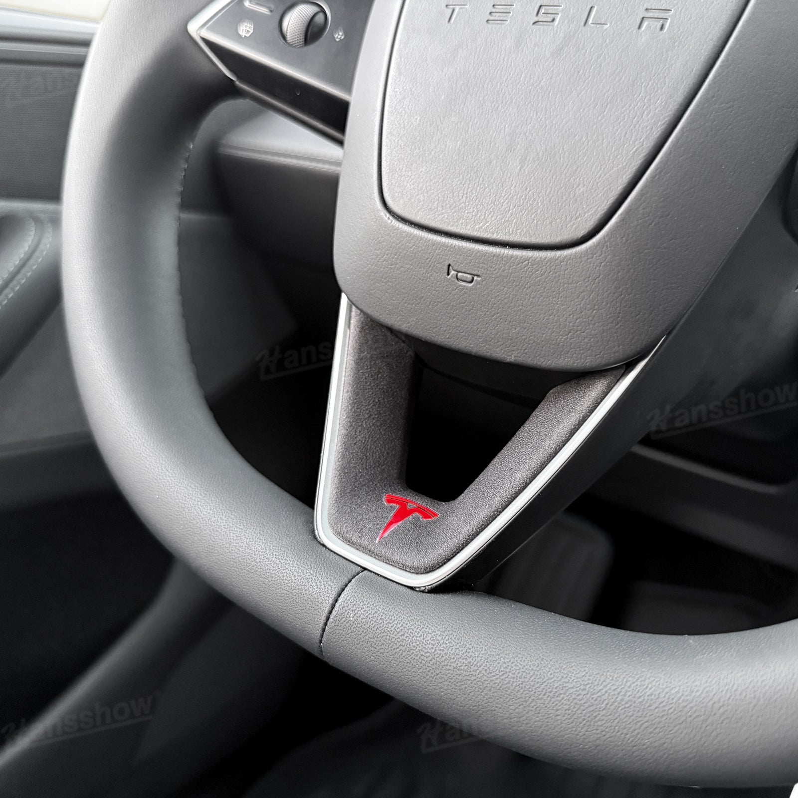 Model Y Juniper Alcantara Trim Cover next to original steering wheel