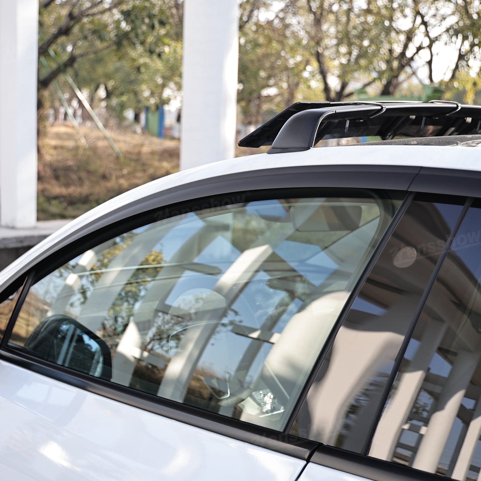 Model Y Juniper Rain Guards with sunlight reflection