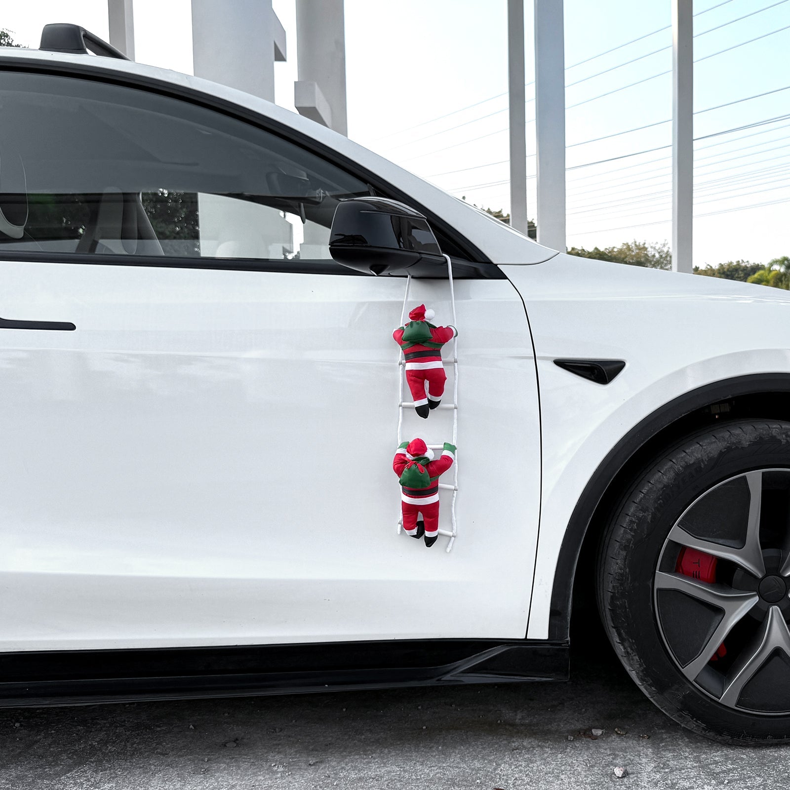 Climbing Santa Claus Decoration for Tesla Model Y with holiday gifts