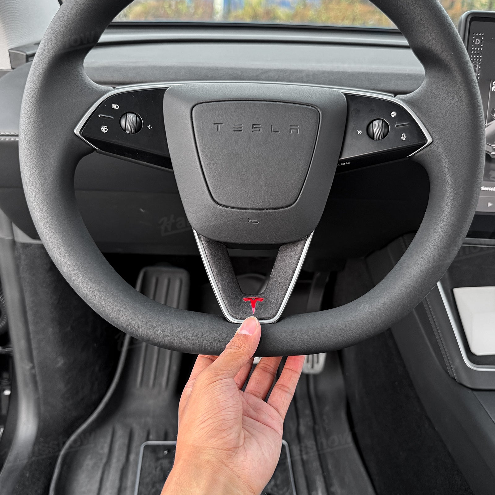 Model Y Juniper Alcantara Trim Cover on black steering wheel