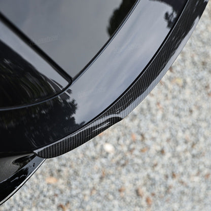 Model 3/Y Real Carbon Fiber Rear Trunk Lip Spoiler in a showroom