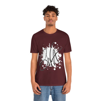 SWA Signature Splash Tee in orange color on table
