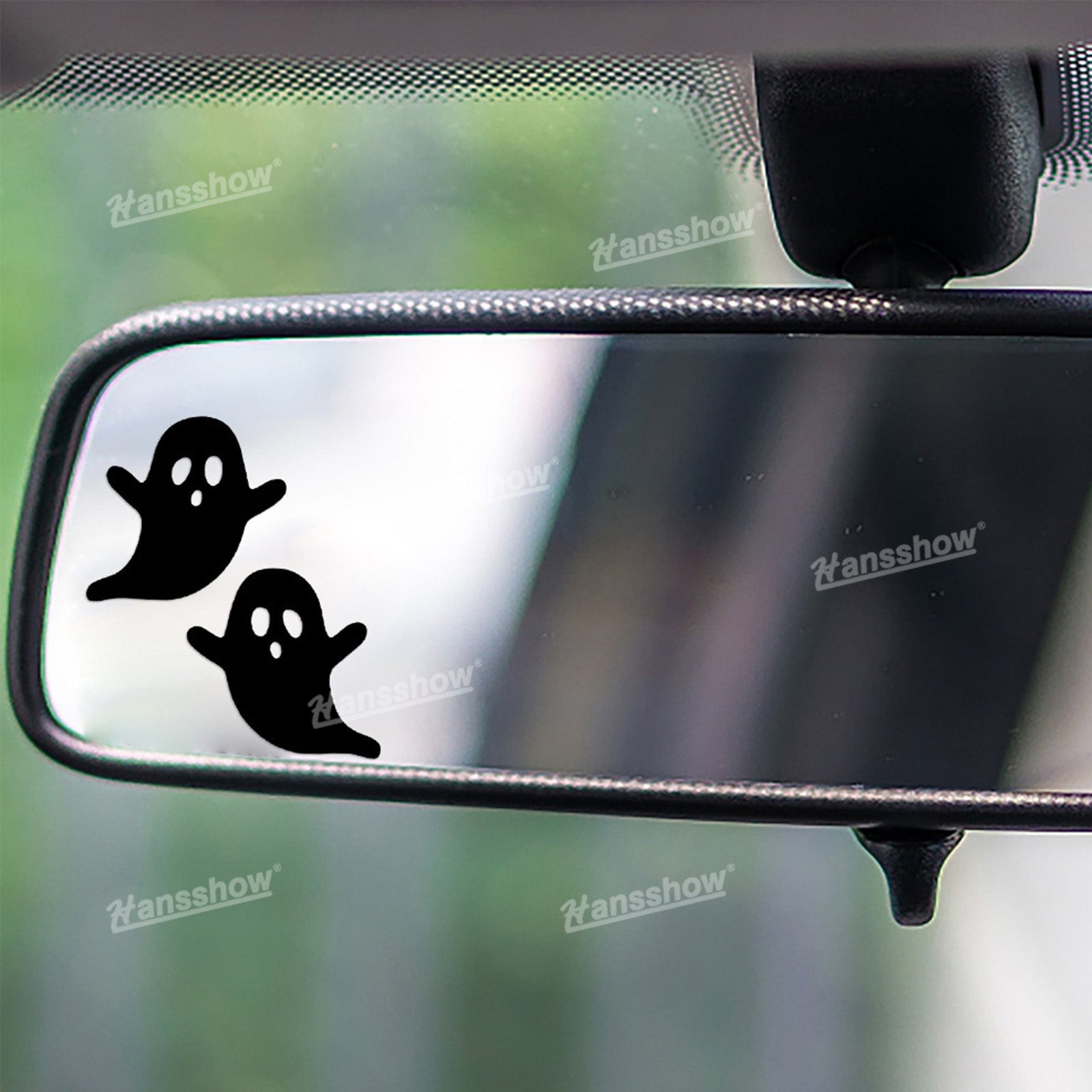 Halloween-themed decoration on Tesla Model Y rearview mirror