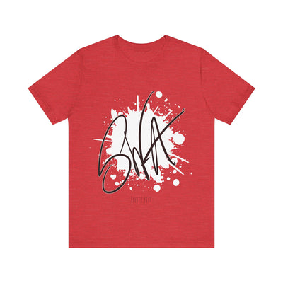 SWA Signature Splash Tee hanging on rack in natural