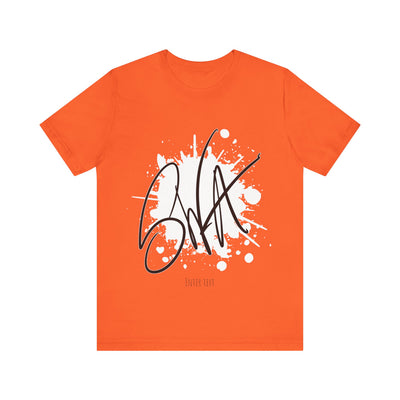 SWA Signature Splash Tee against wall in silver