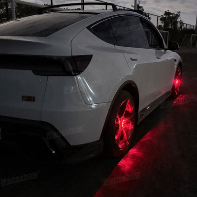 Model Y Juniper Wheel Hub Lights remote in hand