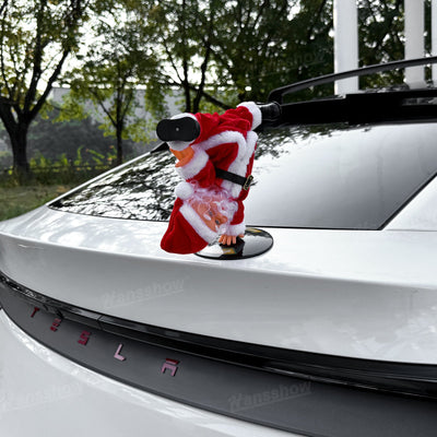 Santa Claus in action with music in Tesla Model Y trunk