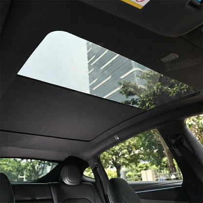 Model Y Juniper Power Sunshade with Tesla logo in background