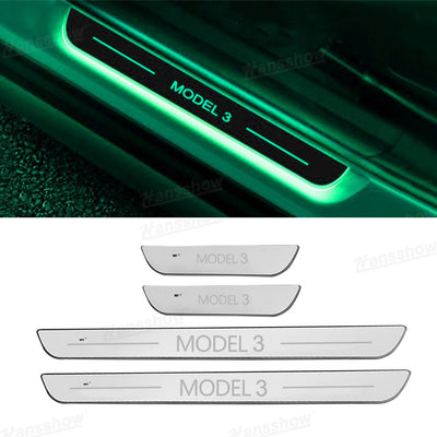 Model Y Juniper RGB Door Sill Plates during nighttime