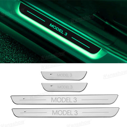 Model Y Juniper RGB Door Sill Plates during nighttime