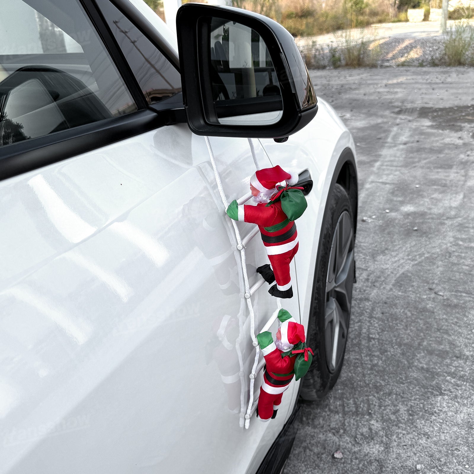 Climbing Santa Claus Decoration for Tesla Model Y on display
