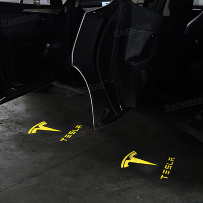 64-Color Changing Puddle Lights illuminating Tesla Model 3 at night