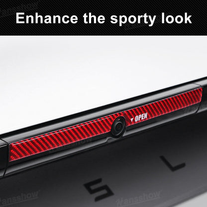 Model Y Juniper Trunk Button Sticker in low light